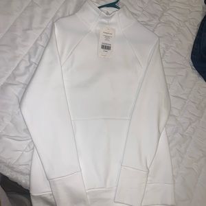 White Fabletics sweater